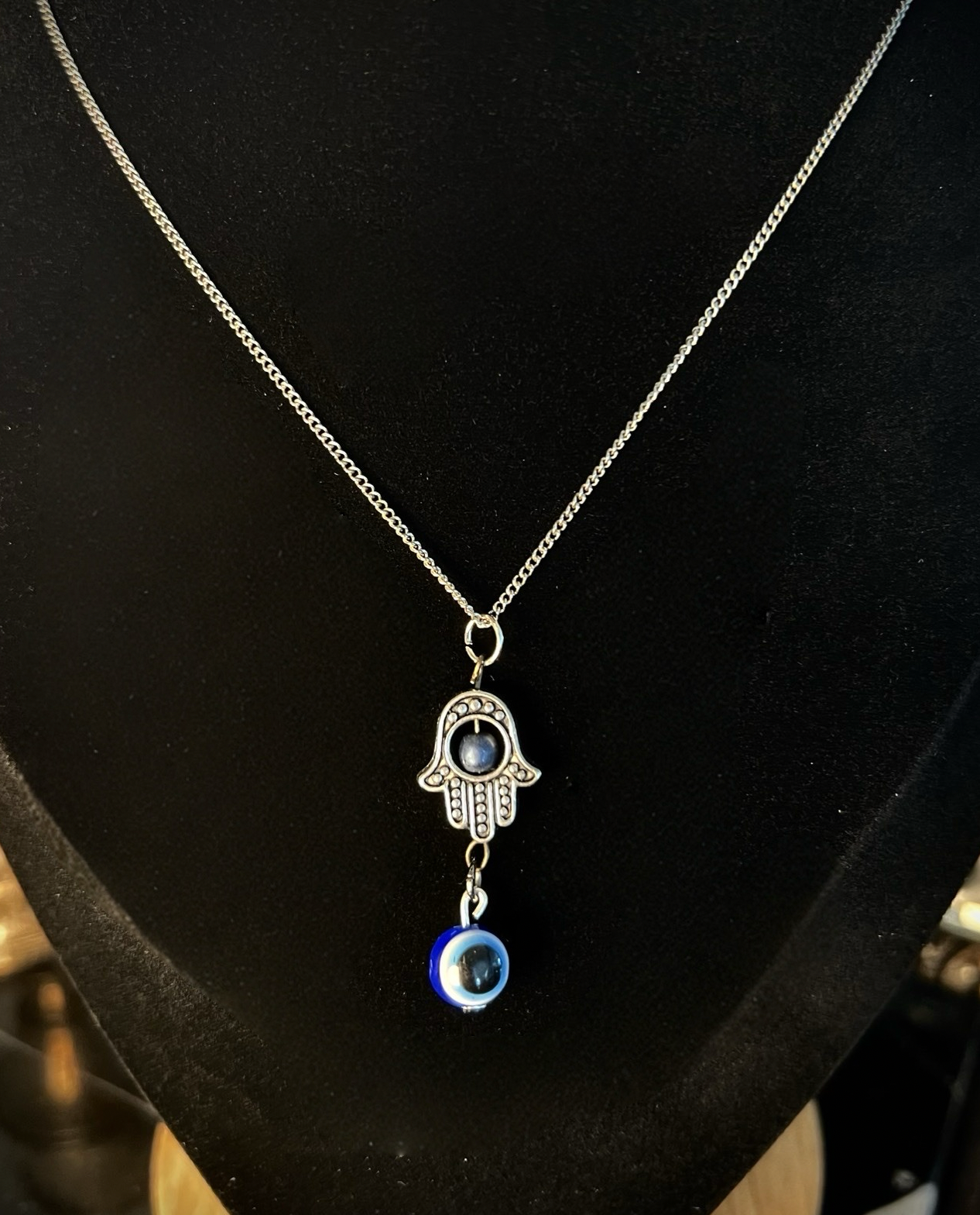 Hamsa hand and evil eye charm on 16 inch silver tone chain