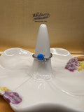 Sterling silver cz and lab created blue opal bypass ring size 5.5