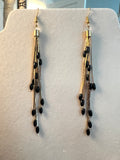 Vintage 1980s liquid gold tone and black tassel dangle earrings